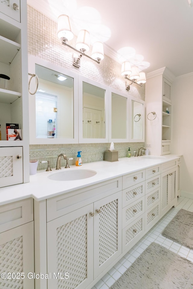 bathroom with double vanity, decorative backsplash, a sink, and tile patterned floors