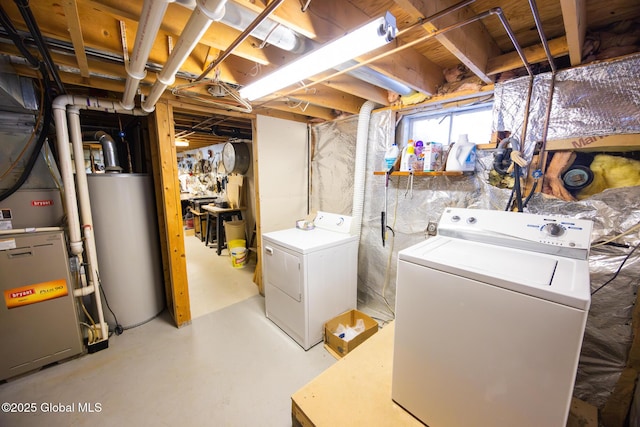 below grade area with washing machine and clothes dryer and water heater