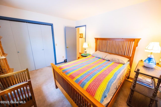 carpeted bedroom featuring a closet