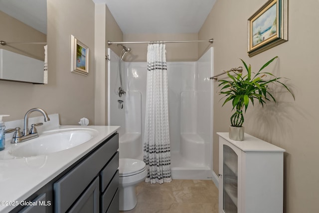 bathroom featuring a shower with curtain, vanity, and toilet