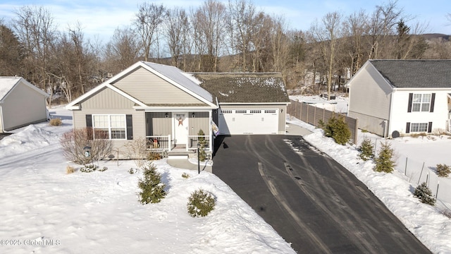 view of front of home with a garage and a porch