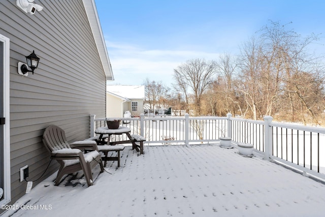 view of snow covered deck