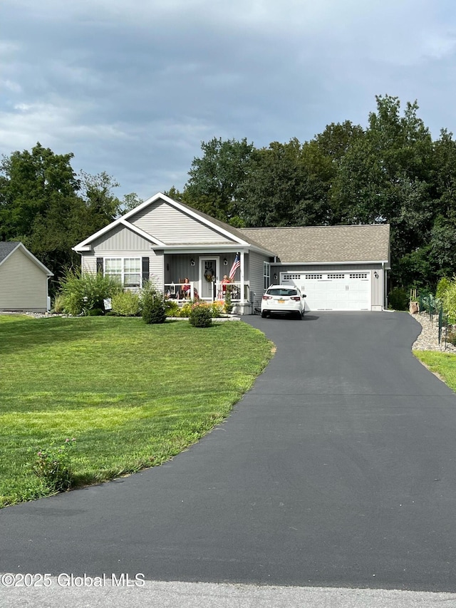 ranch-style home with a porch, a garage, board and batten siding, and a front lawn