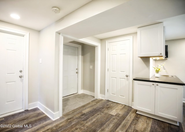 bar with baseboards and dark wood-style floors