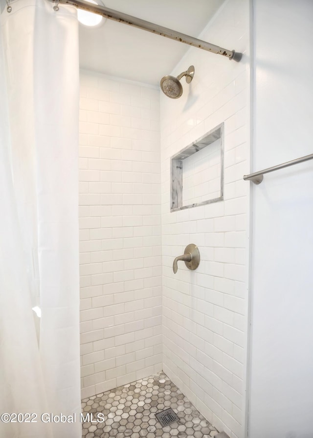 full bathroom with a shower stall