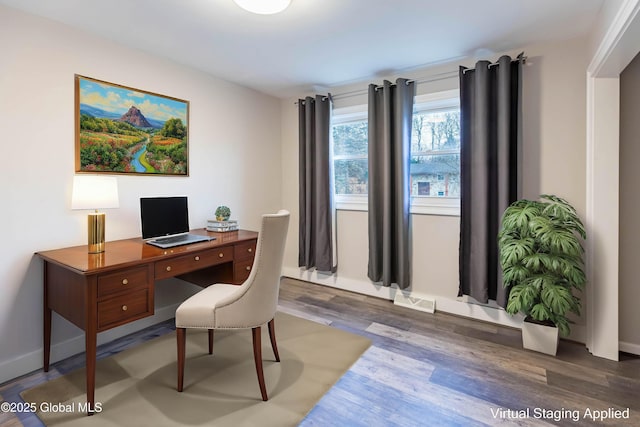 office space featuring wood finished floors and visible vents