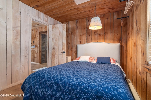 bedroom featuring wood ceiling, wooden walls, and wood finished floors