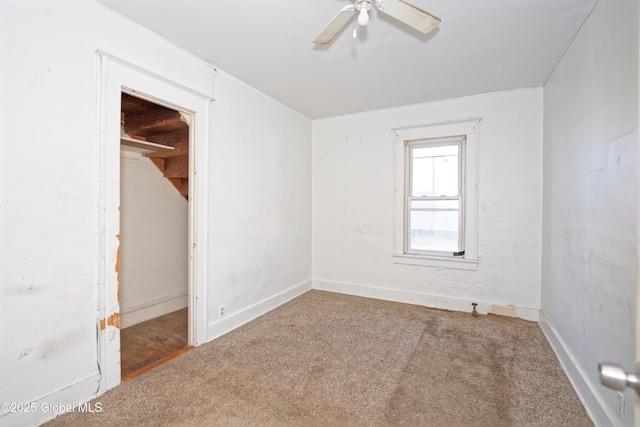 unfurnished bedroom with carpet flooring, ceiling fan, and baseboards