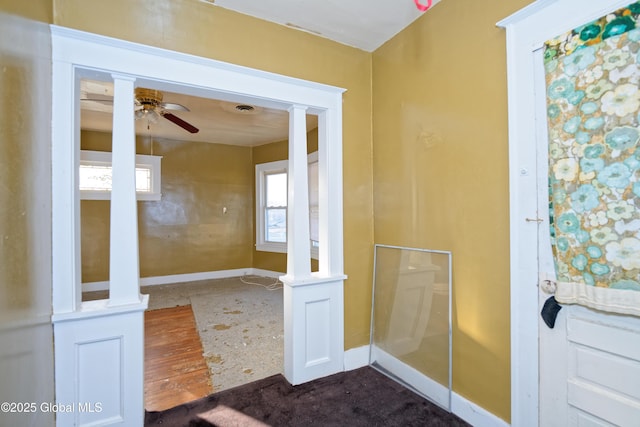 bathroom featuring baseboards and ceiling fan