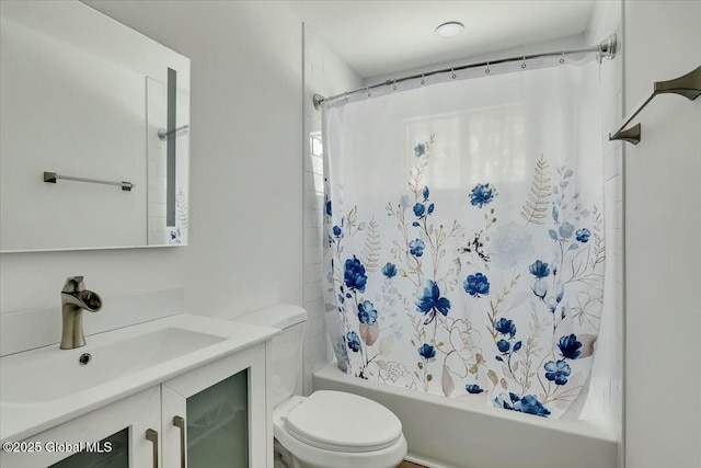 full bath featuring shower / tub combo, vanity, and toilet