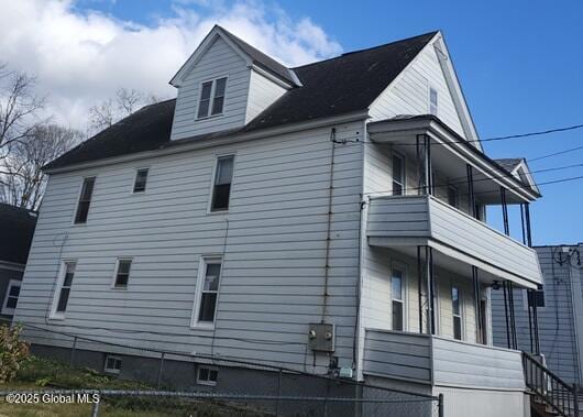 view of property exterior with a balcony