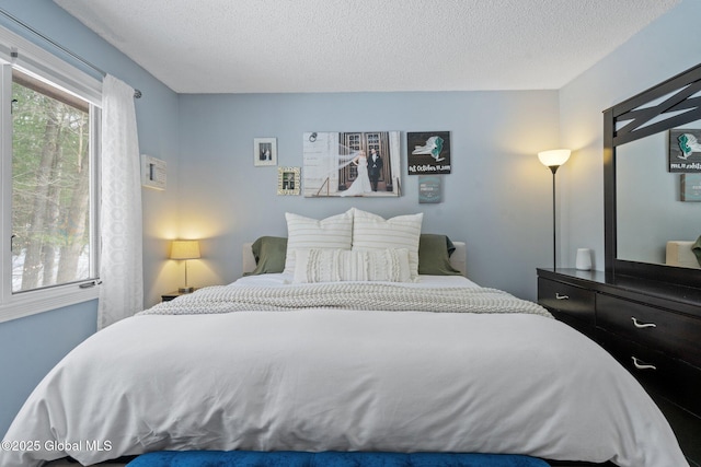 bedroom featuring a textured ceiling