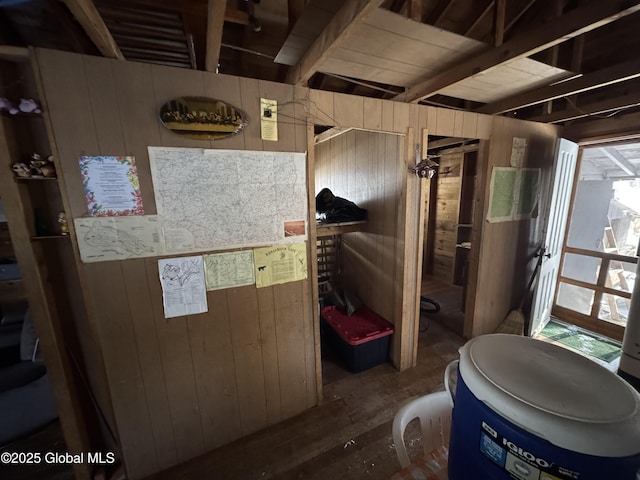 bathroom with wooden walls and wood finished floors