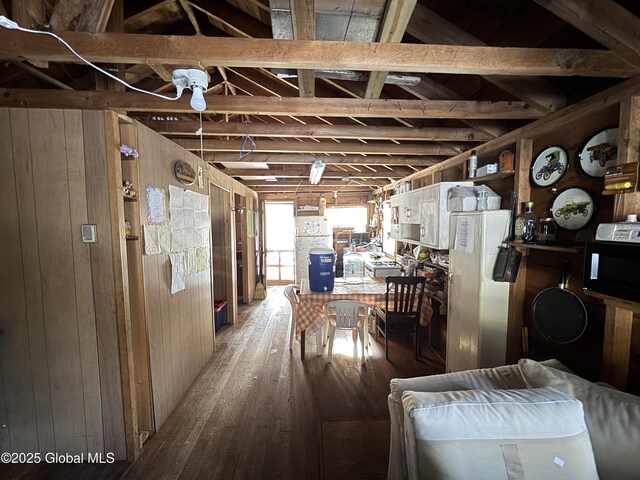 interior space featuring wooden walls and hardwood / wood-style flooring