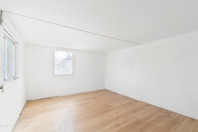 unfurnished room featuring light wood-style floors