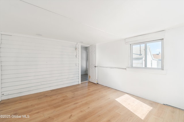 empty room with light wood finished floors