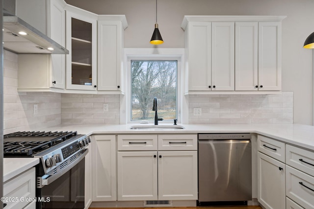 706 Swaggertown Rd, Charlton, NY 12302 - kitchen featuring appliances with stainless steel finishes, a sink, wall chimney exhaust hood, and white cabinets