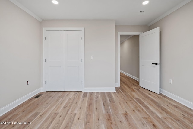 706 Swaggertown Rd, Charlton, NY 12302 - unfurnished bedroom with recessed lighting, light wood-style flooring, baseboards, ornamental molding, and a closet