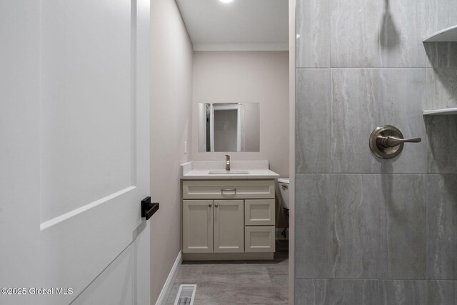 706 Swaggertown Rd, Charlton, NY 12302 - bathroom with vanity, a tile shower, toilet, wood finished floors, and baseboards