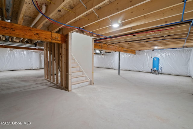 706 Swaggertown Rd, Charlton, NY 12302 - unfinished below grade area featuring a water pressure tank and stairway