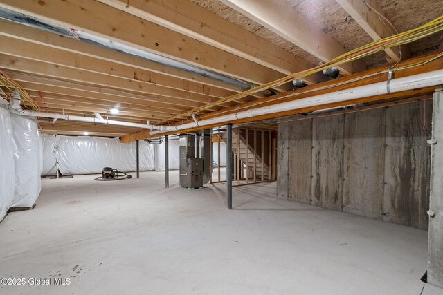 706 Swaggertown Rd, Charlton, NY 12302 - unfinished below grade area with heating unit and stairway