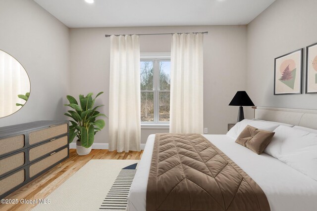 706 Swaggertown Rd, Charlton, NY 12302 - bedroom featuring light wood-style flooring, baseboards, and recessed lighting