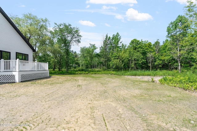 706 Swaggertown Rd, Charlton, NY 12302 - view of yard featuring a deck and a forest view