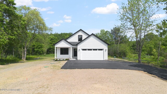 706 Swaggertown Rd, Charlton, NY 12302 - view of front of home featuring asphalt driveway and an attached garage