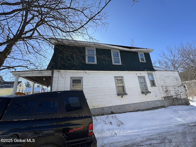 view of snow covered property