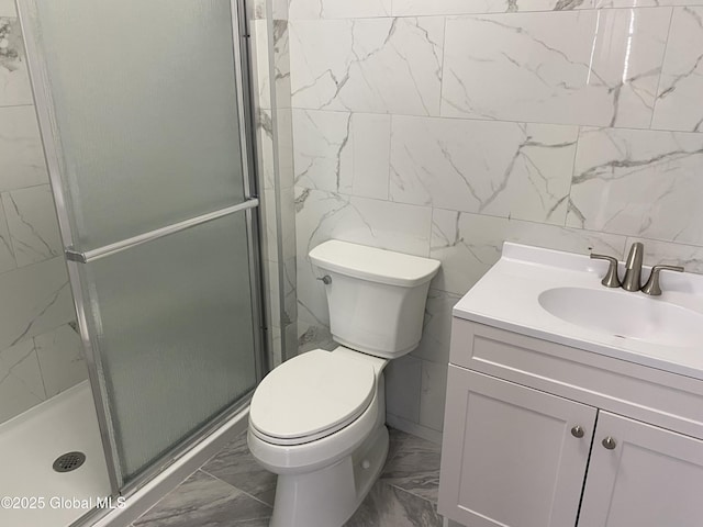 full bath featuring toilet, marble finish floor, and a shower stall