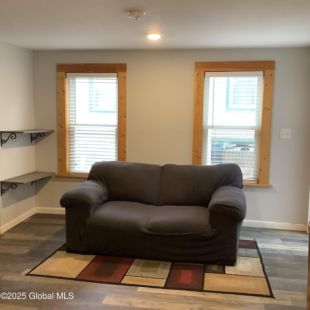 living area featuring recessed lighting, baseboards, and wood finished floors