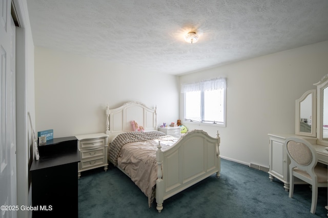 bedroom featuring a textured ceiling, dark carpet, and baseboards