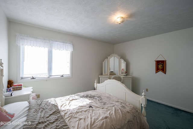 carpeted bedroom with a textured ceiling and baseboards