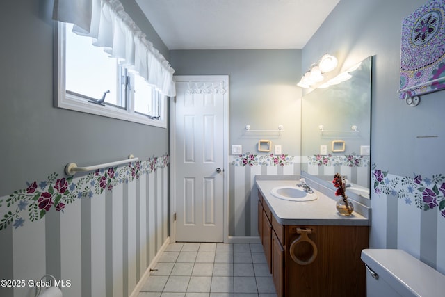 full bathroom featuring baseboards, vanity, toilet, and tile patterned floors