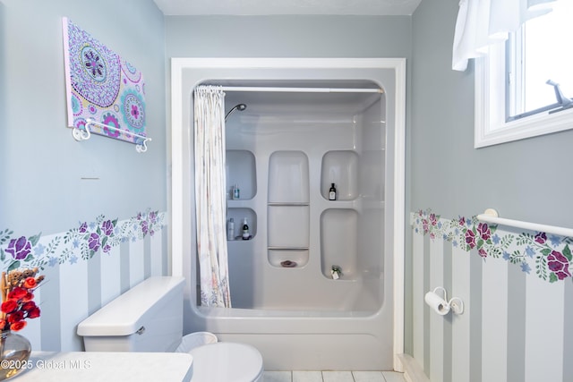 bathroom with toilet, vanity, and tile patterned floors