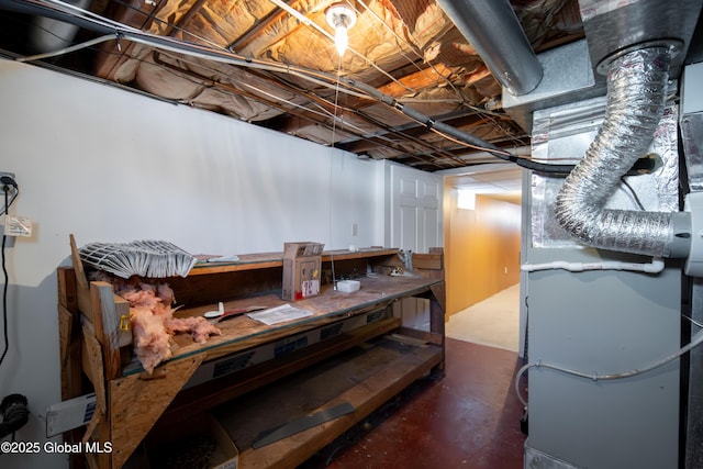 unfinished basement featuring heating unit