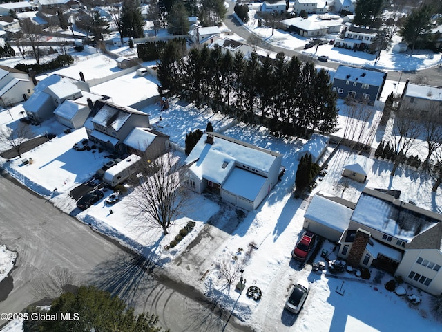 snowy aerial view featuring a residential view