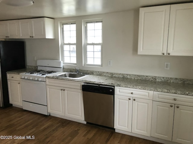 kitchen with white cabinetry, freestanding refrigerator, dark wood-style floors, dishwasher, and white range with gas cooktop