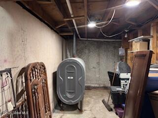 unfinished basement featuring heating fuel