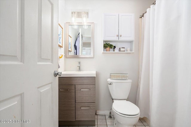 full bath featuring vanity, toilet, and tile patterned floors