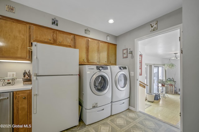 laundry area featuring light floors, independent washer and dryer, laundry area, and recessed lighting