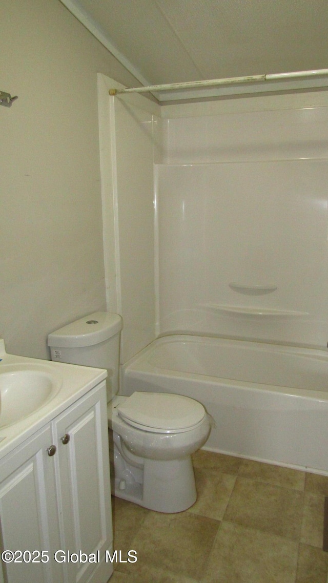 bathroom featuring toilet, shower / washtub combination, tile patterned flooring, and vanity