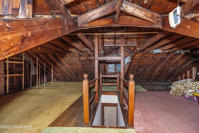 attic featuring an upstairs landing