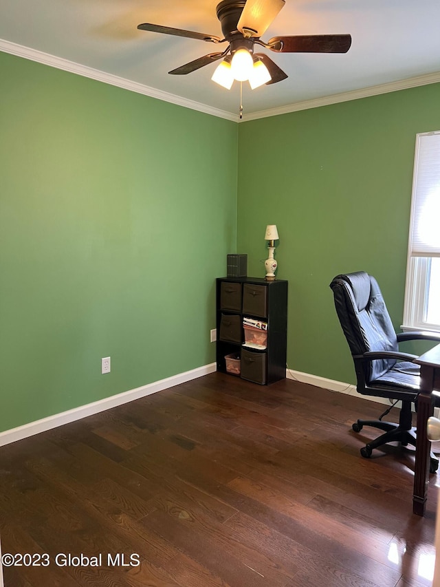 unfurnished office with dark wood-style floors, ceiling fan, ornamental molding, and baseboards