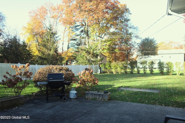 view of patio / terrace with a grill and fence