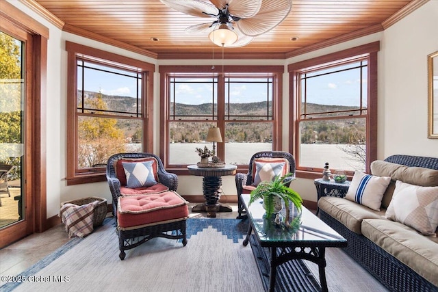 sunroom / solarium with a mountain view and wood ceiling