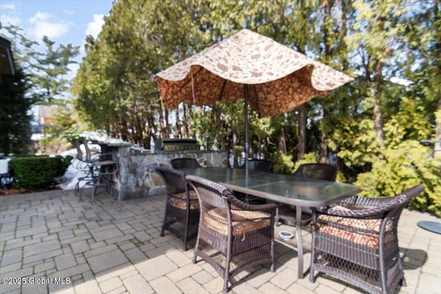 view of patio / terrace with outdoor dry bar and outdoor dining area