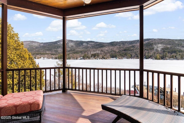 wooden deck featuring a mountain view