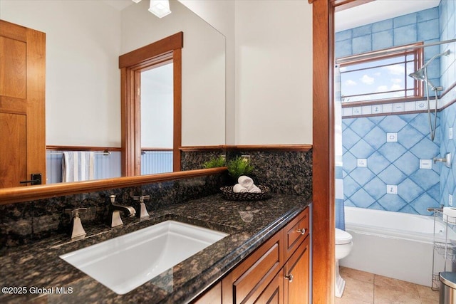 bathroom with vanity, decorative backsplash, bathtub / shower combination, tile patterned flooring, and toilet