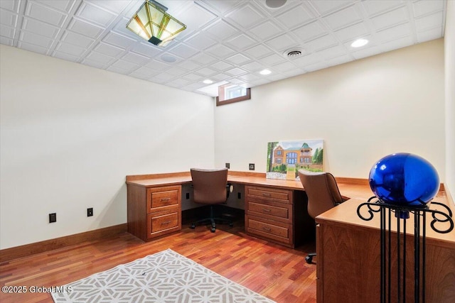 office featuring recessed lighting, visible vents, baseboards, and light wood finished floors